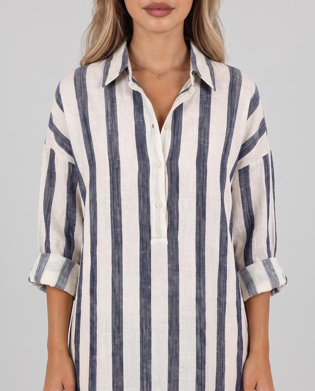 Women's blue and cream striped shirt dress, maxi length with a collar and long sleeves, close-up of the collar and button placket