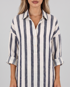 Women's blue and cream striped shirt dress, maxi length with a collar and long sleeves, close-up of the collar and button placket