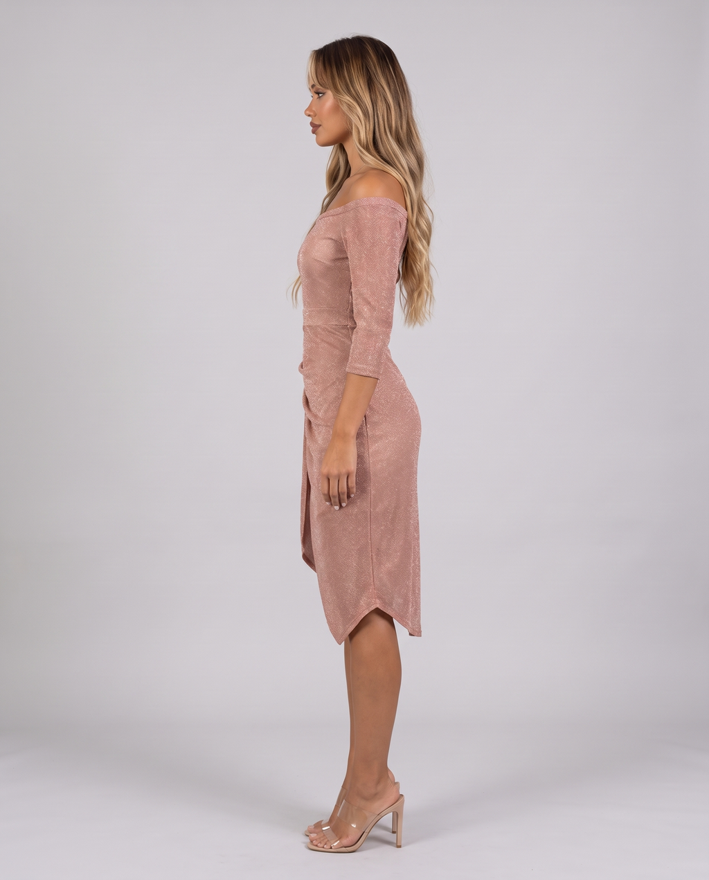 Women's champagne shimmer off shoulder midi dress with a draped wrap skirt, side view