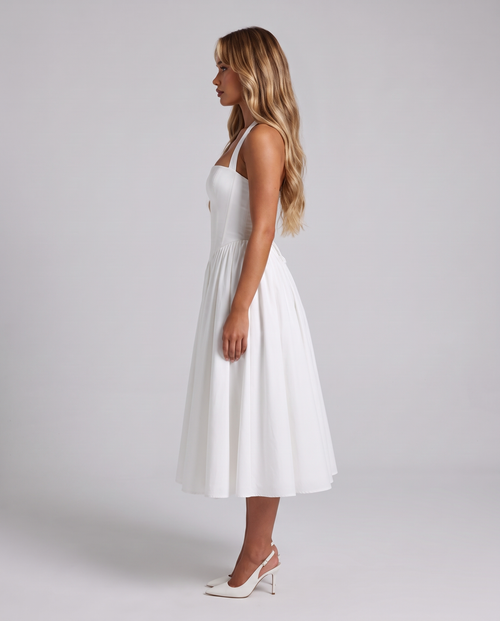 Women's white halter neck corset midi dress with a square neckline and full skirt, side view