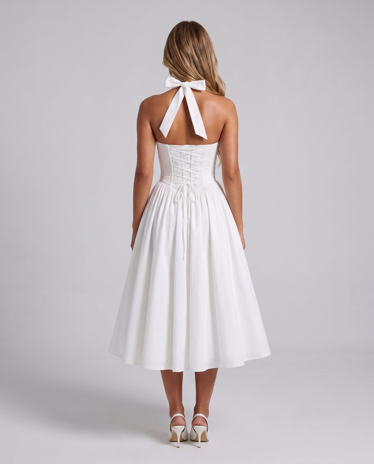 Women's white halter neck corset midi dress with a square neckline and full skirt, back view