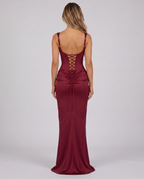 Women's wine red corset maxi dress with a square neck, draped hip and lace-up back, back view