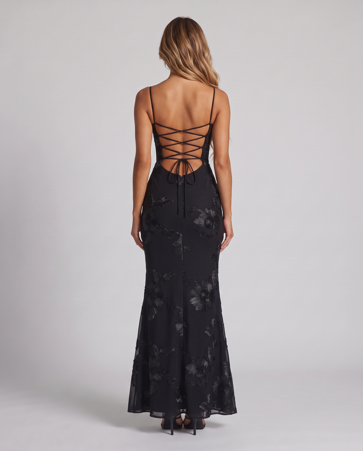 Women's black floral embroidered corset maxi dress with a fishtail skirt, back view