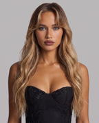 Women's black floral embroidered corset maxi dress with a fishtail skirt, close-up of the sweetheart corset bodice and floral embroidery