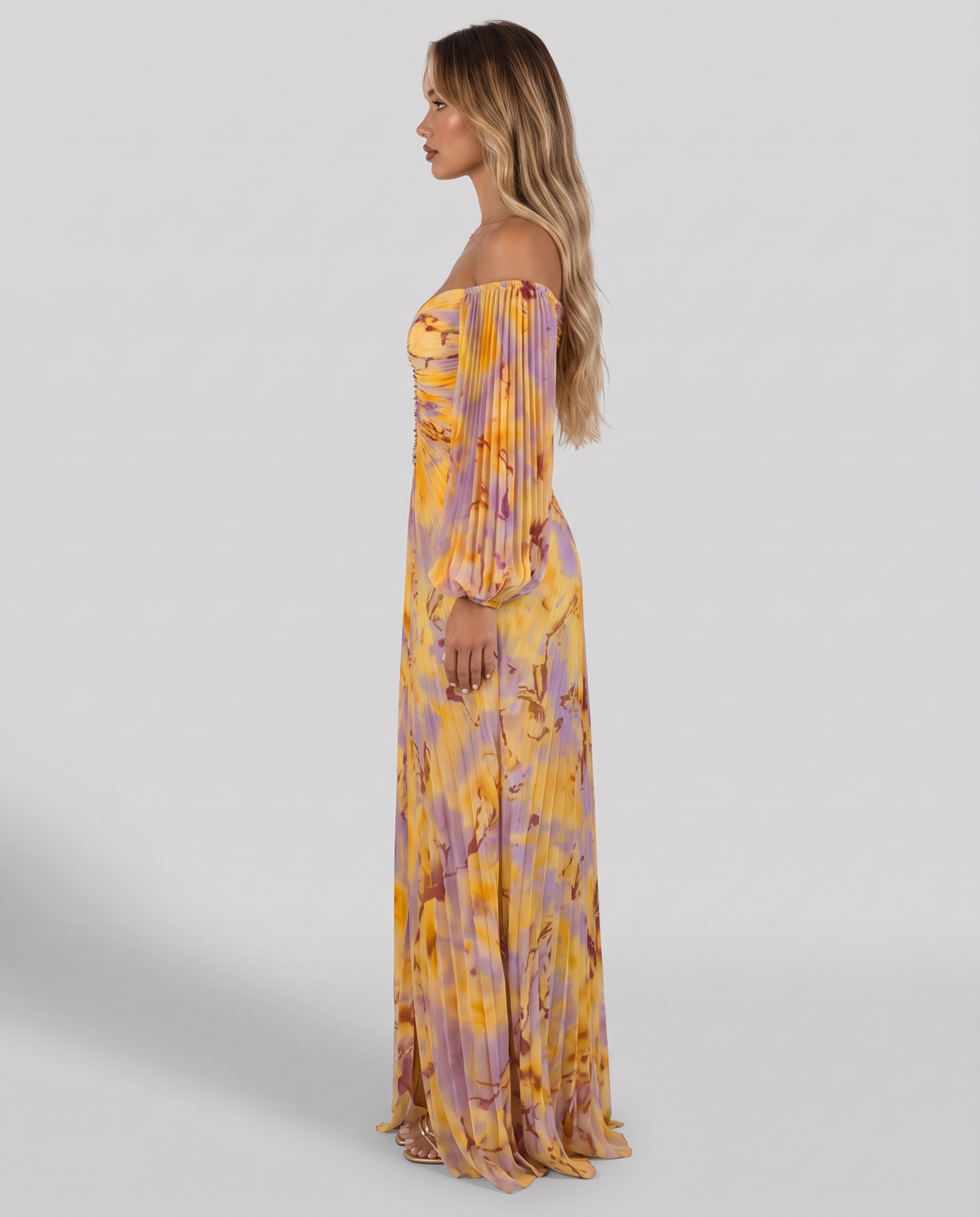 Women's yellow and lilac print off shoulder maxi dress with pleated balloon sleeves, side view