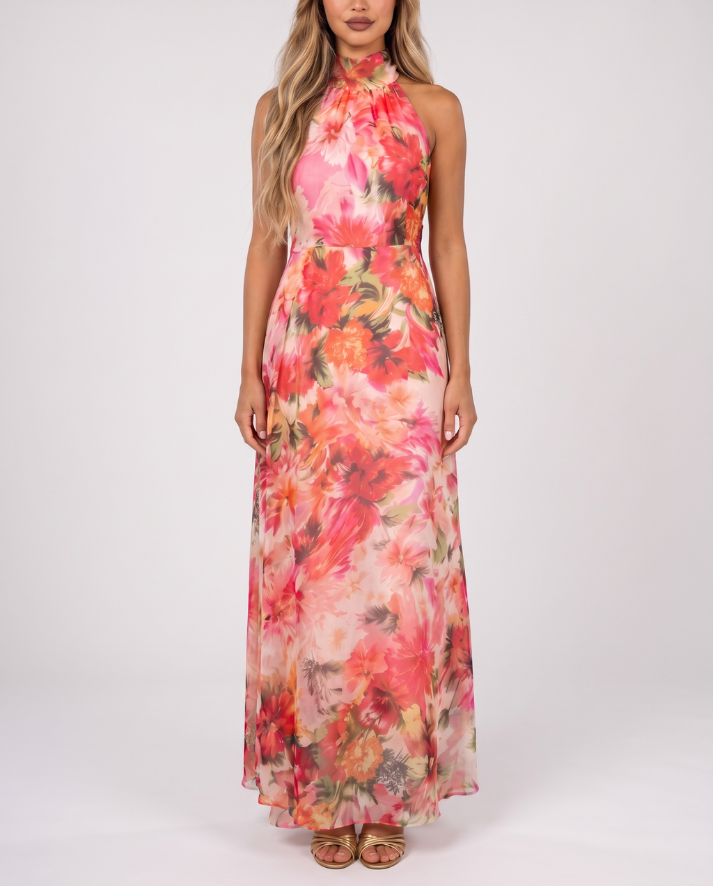 Women's coral pink floral halter neck maxi dress with a floaty A-line skirt, front view
