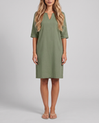 Women's sage green knee length shift dress with a notched neckline and elbow sleeves, front view