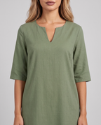 Women's sage green knee length shift dress with a notched neckline and elbow sleeves, close-up of the notched neckline and sleeves